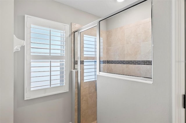 full bath featuring a tile shower