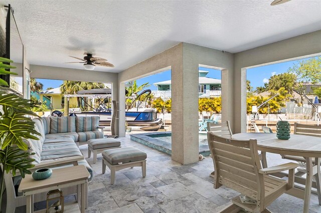 view of patio with outdoor lounge area, a swimming pool, outdoor dining area, and ceiling fan