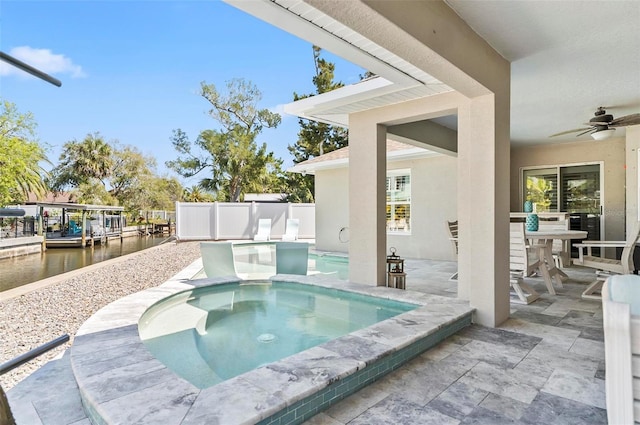 view of pool featuring an in ground hot tub, ceiling fan, and a patio