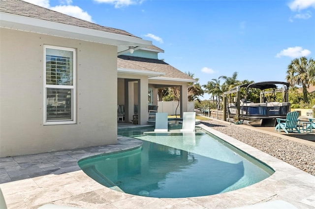 pool featuring a patio area