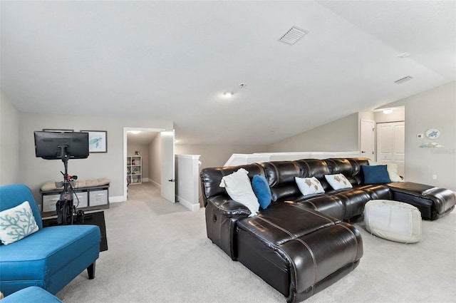 living room with visible vents, baseboards, light colored carpet, and vaulted ceiling