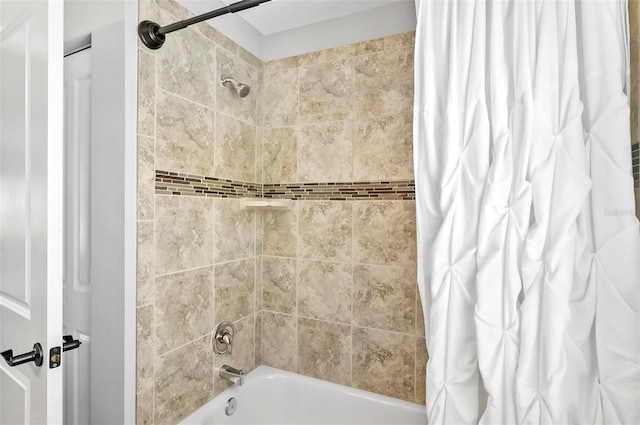 bathroom with shower / bathtub combination with curtain