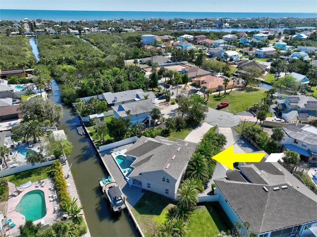 birds eye view of property featuring a residential view and a water view