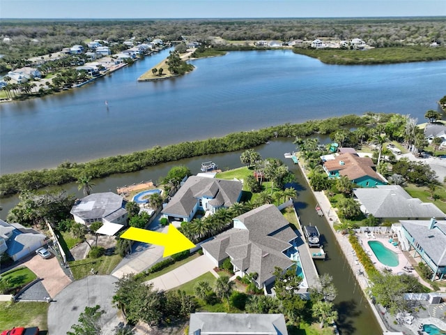 bird's eye view with a residential view and a water view