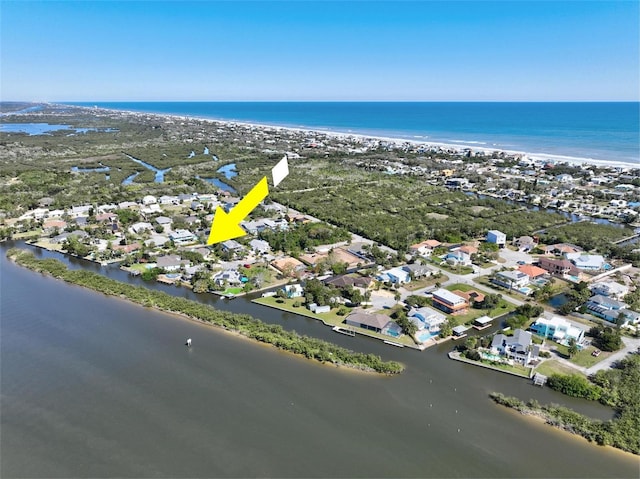 birds eye view of property featuring a water view and a residential view