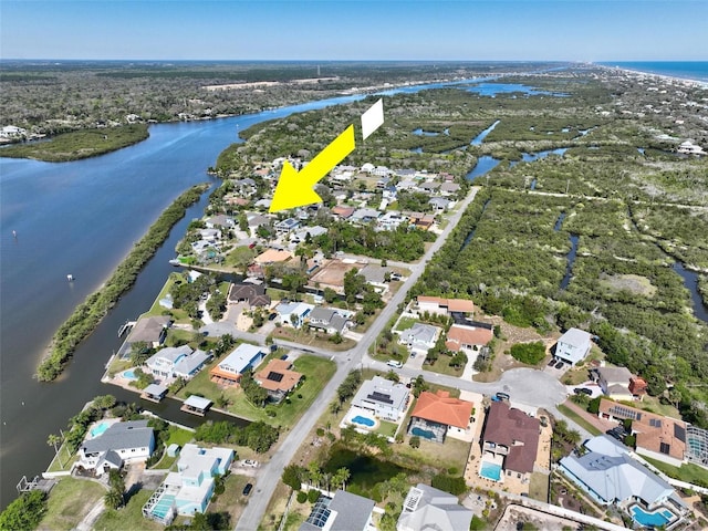 bird's eye view featuring a residential view and a water view