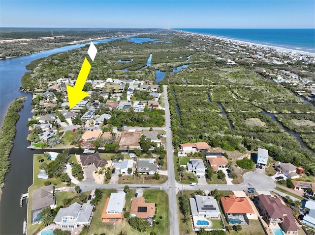 bird's eye view featuring a residential view and a water view