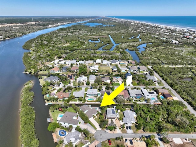 birds eye view of property featuring a water view and a residential view