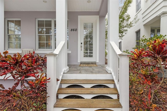 doorway to property featuring a porch