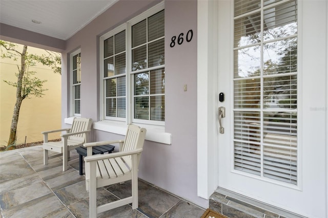 property entrance with covered porch