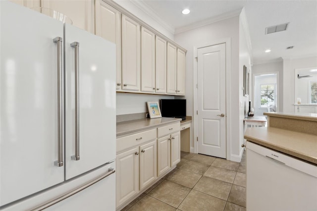 kitchen with visible vents, white appliances, ornamental molding, and light countertops