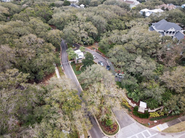 drone / aerial view with a wooded view