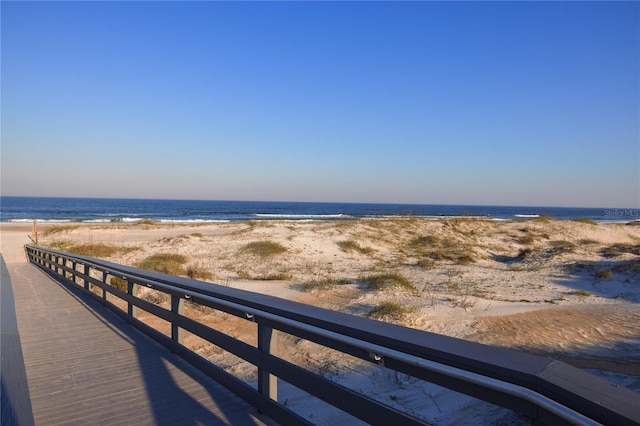 property view of water featuring a beach view