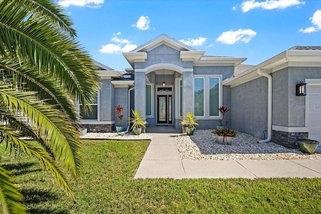 entrance to property with stucco siding