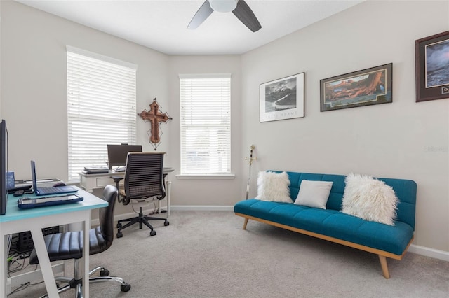 office area featuring ceiling fan, baseboards, and carpet flooring