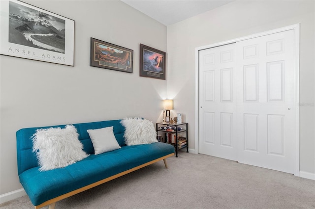 sitting room with carpet flooring and baseboards