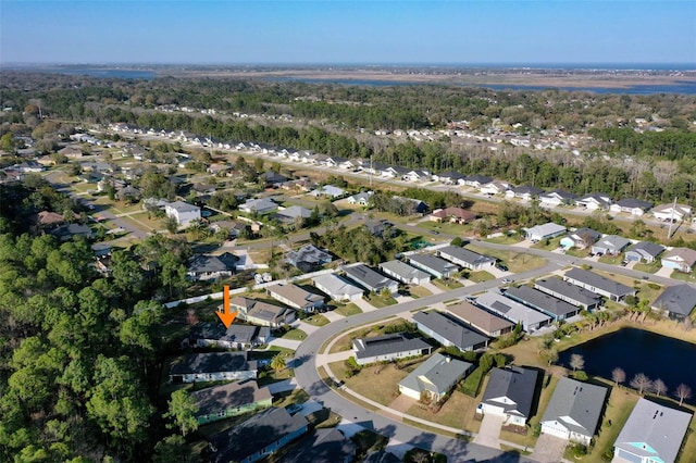 bird's eye view featuring a water view and a residential view