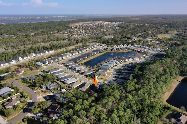 bird's eye view with a water view and a residential view