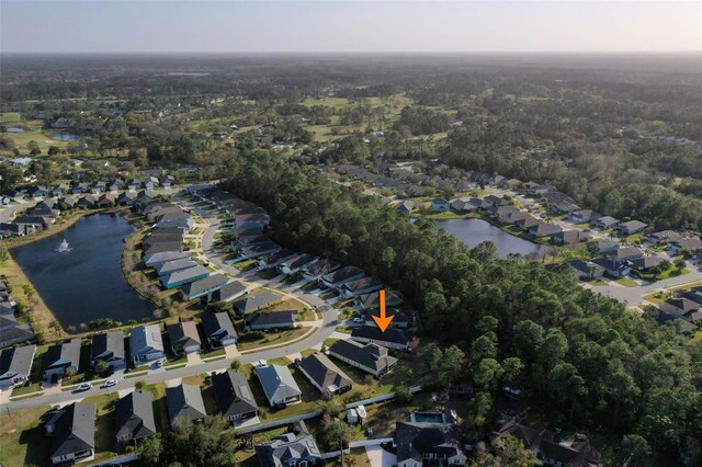 drone / aerial view featuring a residential view and a water view