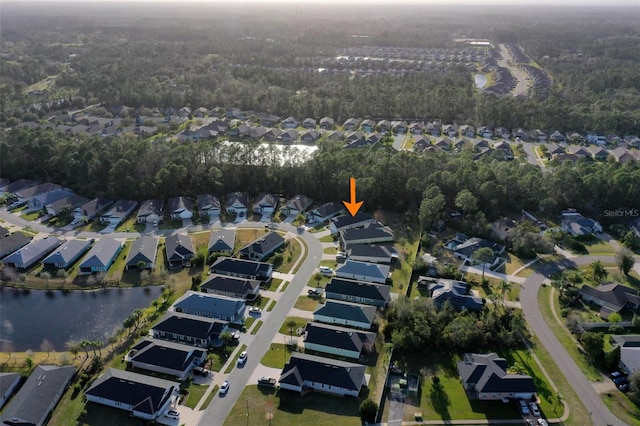 bird's eye view with a water view and a residential view