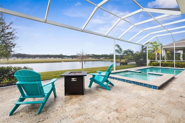 view of pool featuring a water view, a pool with connected hot tub, a lanai, and a patio