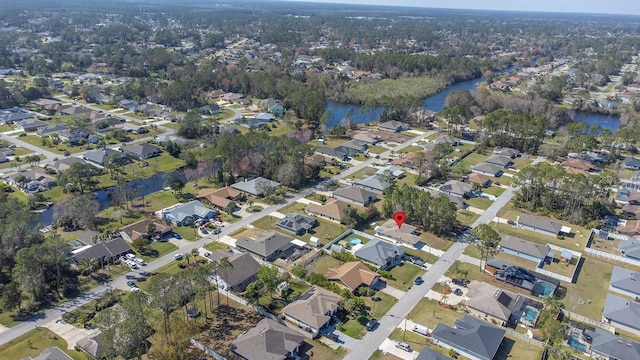 drone / aerial view featuring a residential view and a water view