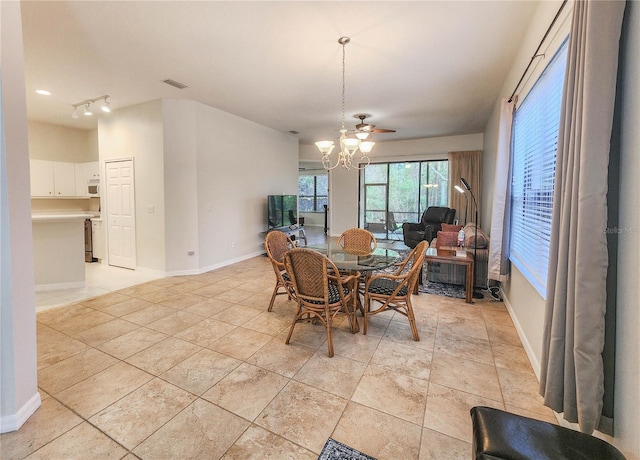 dining area with an inviting chandelier, baseboards, and visible vents