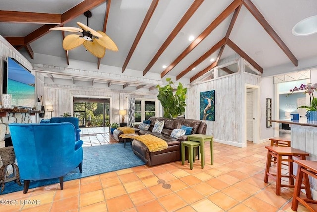 living room featuring vaulted ceiling with beams, tile patterned flooring, a ceiling fan, and baseboards