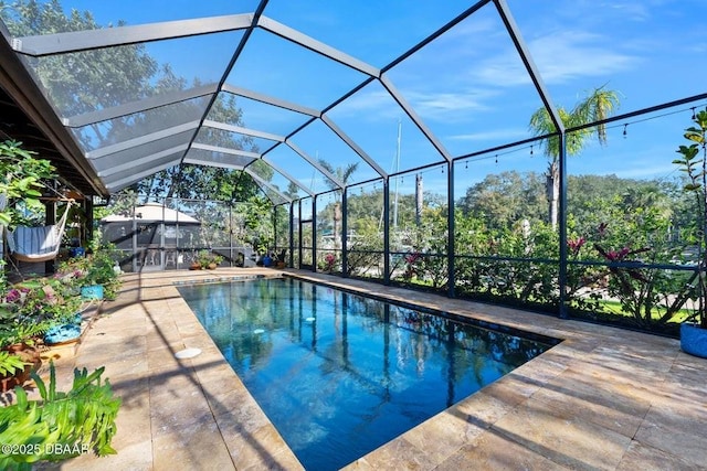 pool with a patio area and a lanai