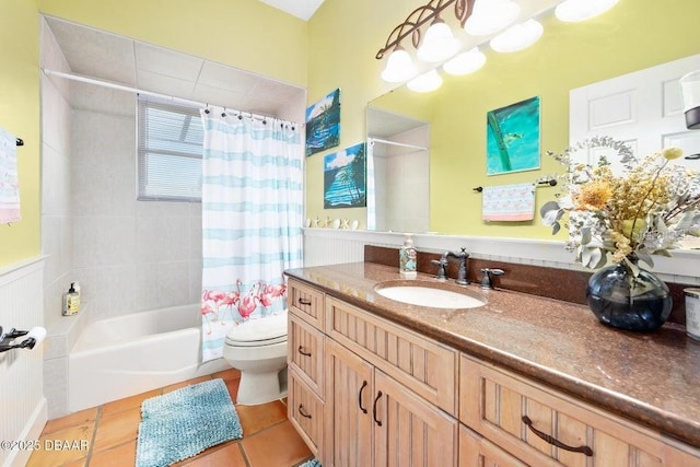 full bathroom featuring toilet, vanity, shower / tub combo with curtain, and tile patterned floors