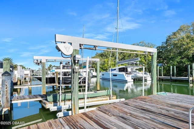 view of dock featuring a water view and boat lift