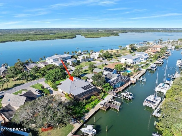 aerial view with a water view and a residential view