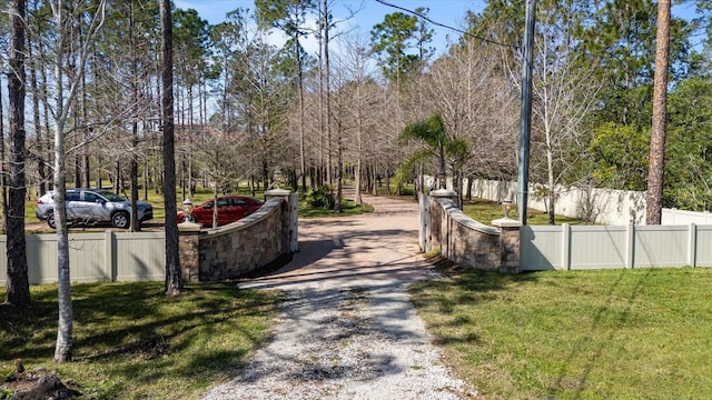 exterior space with a yard and fence