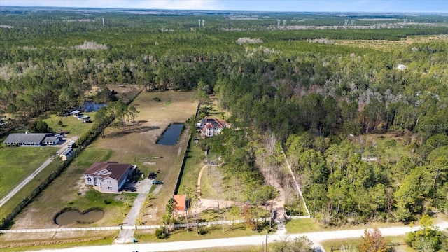 bird's eye view featuring a rural view and a forest view