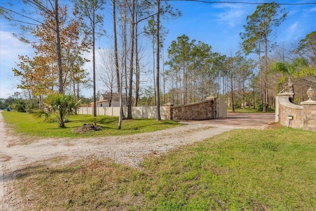 view of road with gravel driveway