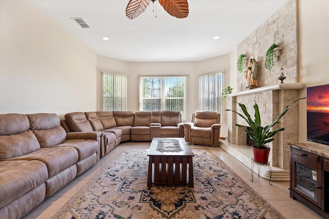 living area with a ceiling fan, recessed lighting, visible vents, and light tile patterned flooring