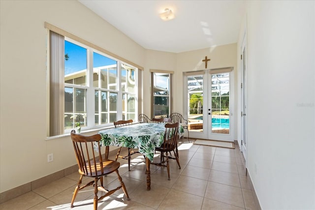 sunroom / solarium featuring french doors