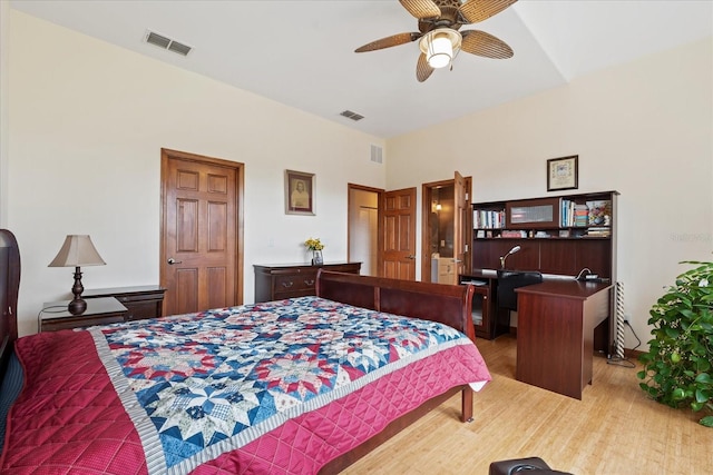 bedroom featuring visible vents and light wood-style floors