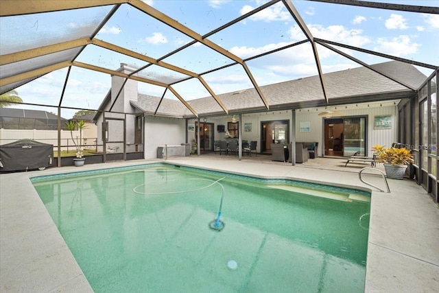 view of swimming pool featuring a lanai, area for grilling, a fenced in pool, and a patio