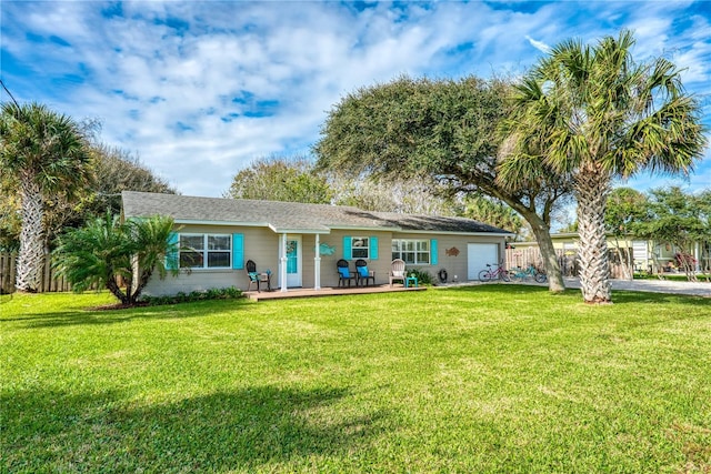 view of front of home with a garage and a front yard