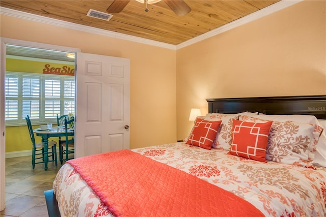 bedroom with wood ceiling, ornamental molding, tile patterned flooring, and visible vents