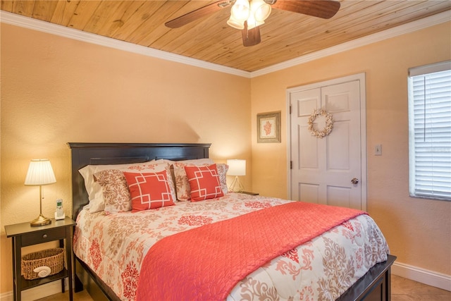 bedroom featuring baseboards, ceiling fan, wood ceiling, and crown molding