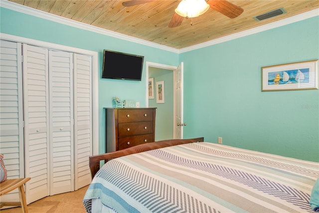 bedroom with visible vents, a ceiling fan, wood ceiling, crown molding, and a closet