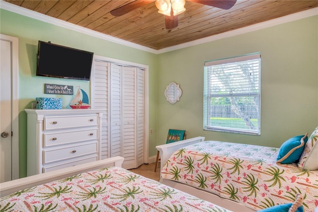 bedroom with wooden ceiling, a ceiling fan, and crown molding