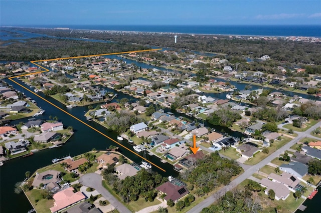 aerial view featuring a water view and a residential view