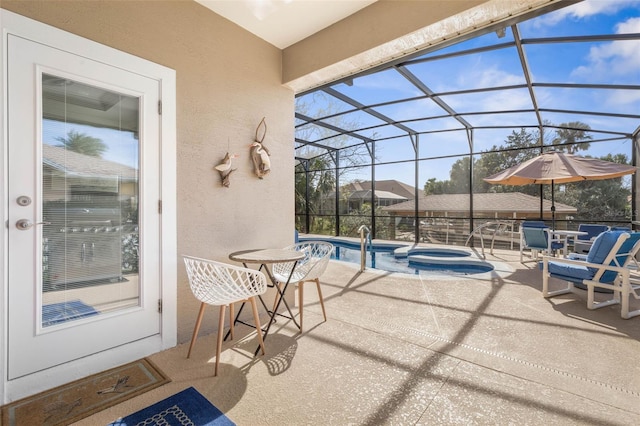 view of patio with a pool with connected hot tub and glass enclosure