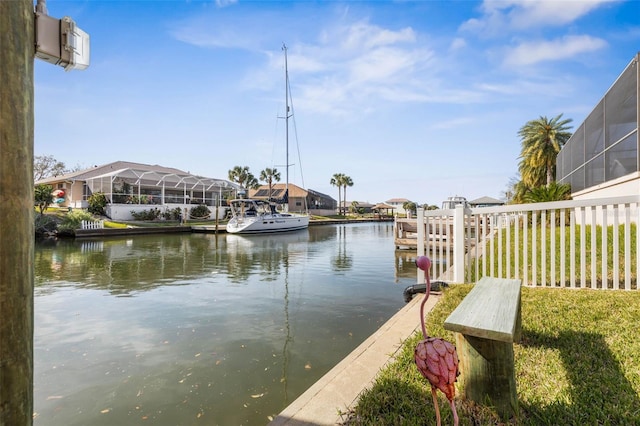 view of dock with a water view and a residential view