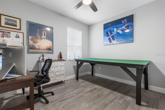 office space featuring ceiling fan, baseboards, and wood finished floors