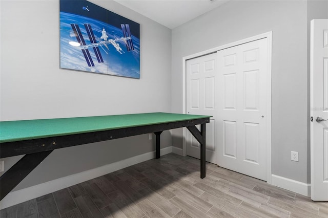 office featuring baseboards and wood finish floors