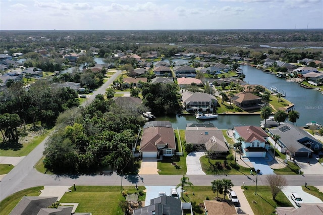 birds eye view of property featuring a water view and a residential view